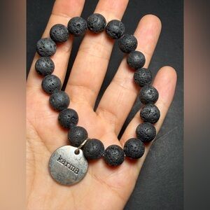 Lava Bead Bracelet with Karma Charm